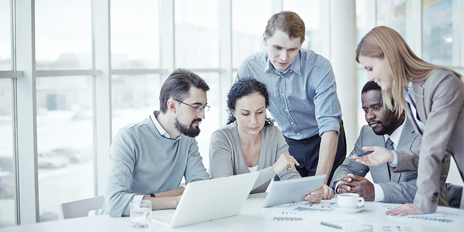 Group of atradius coworkers working together